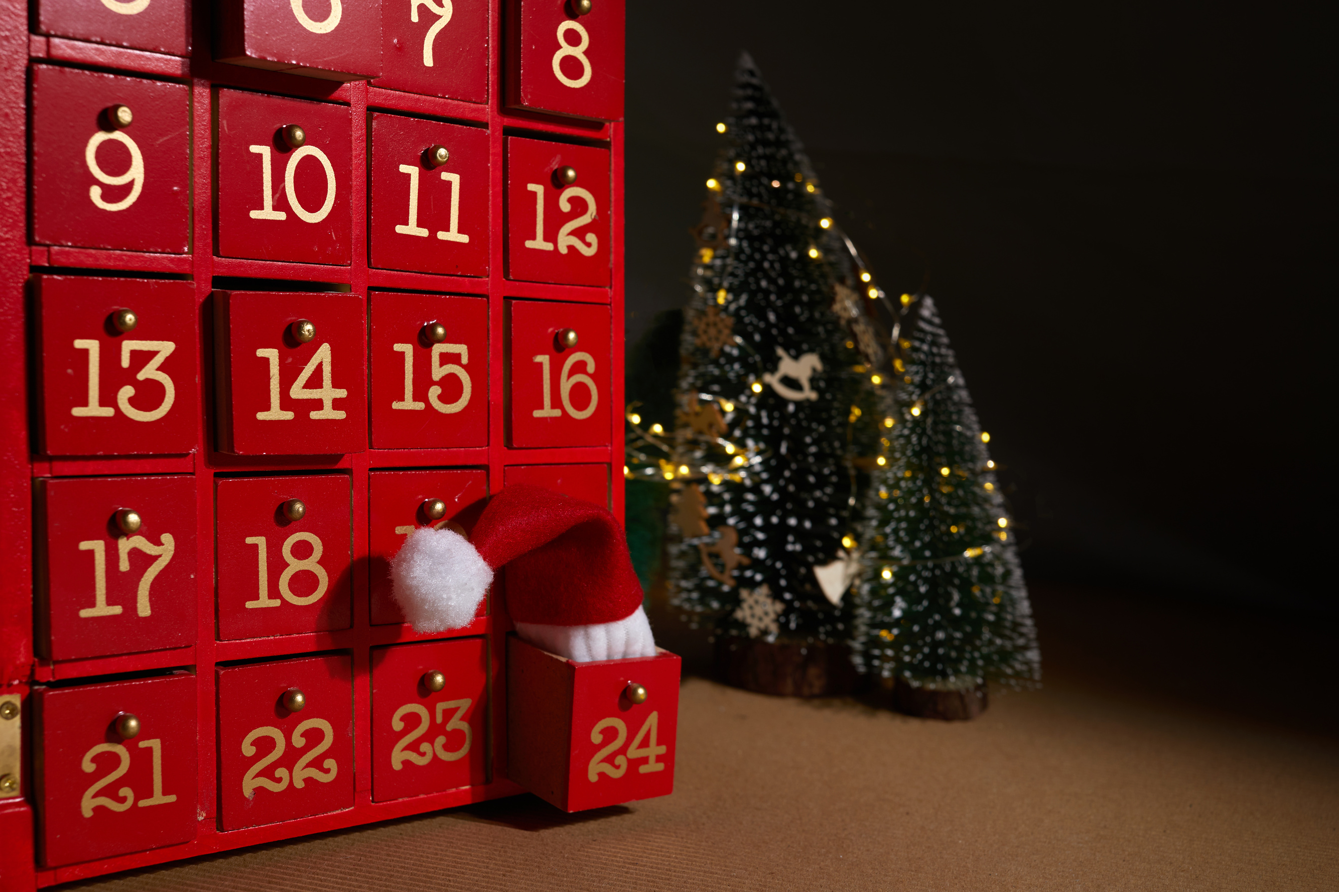 Red Christmas Advent Calendar with Santa Claus Hat.